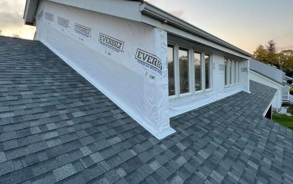 Close-up of metal roof flashing installation by ELED Construction